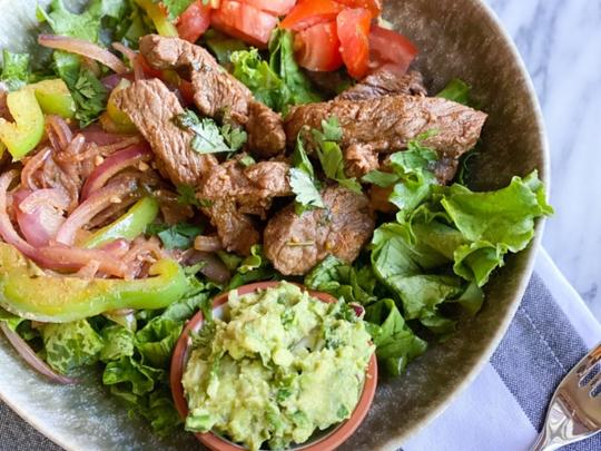 Fajita Marinated Steak Over A Salad